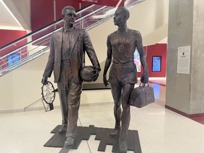 The statue of Bill Garrett (right) and coach Branch McCracken (left) stands in the south lobby of Simon Skjodt Assembly Hall in Bloomington, Ind.